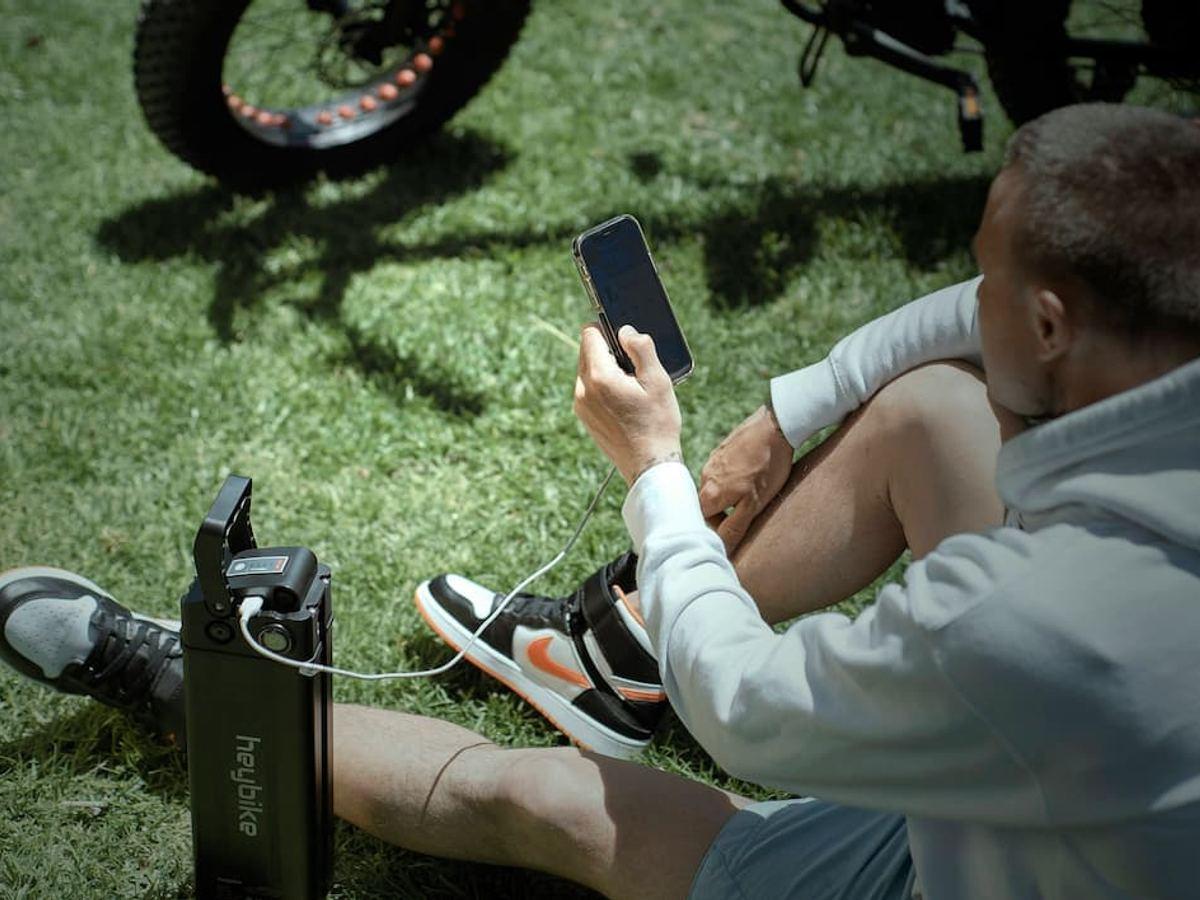 Mentor using phone outdoors
